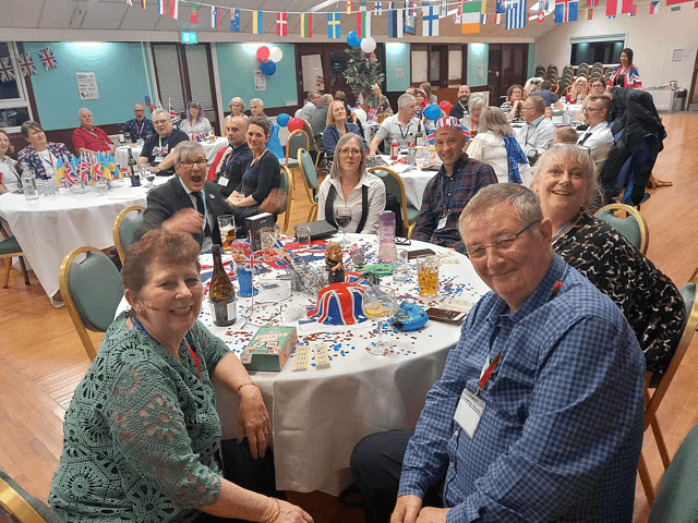 Mutual Support members seated around a table